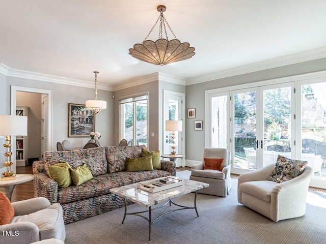 living room with french doors, ornamental molding, and hardwood / wood-style flooring