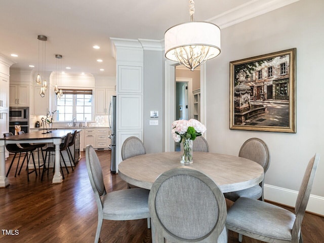 dining space featuring crown molding, dark hardwood / wood-style floors, and a notable chandelier