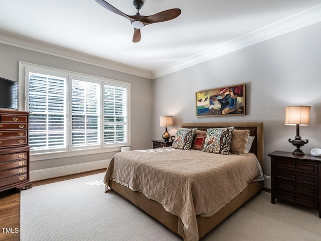 bedroom with ceiling fan, ornamental molding, and light hardwood / wood-style flooring