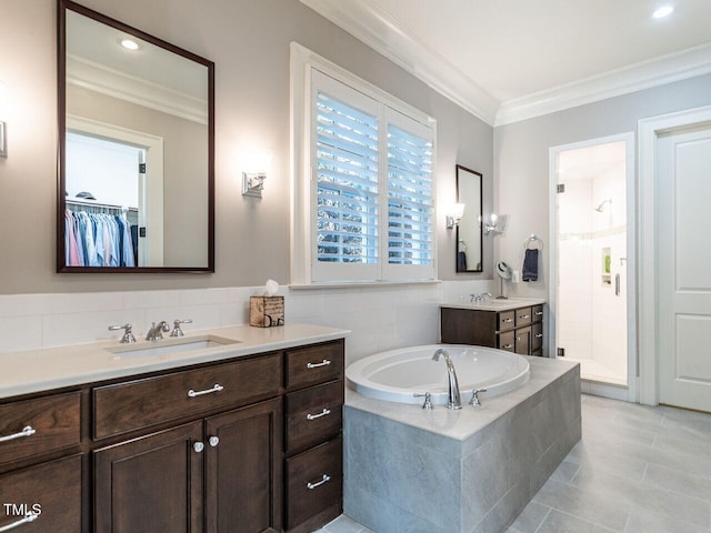 bathroom with vanity, tile patterned flooring, ornamental molding, and plus walk in shower