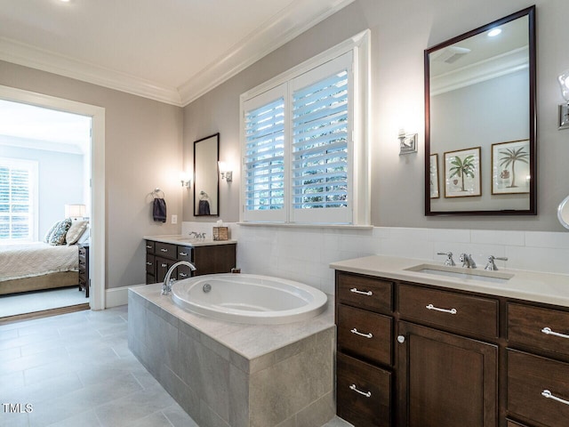 bathroom with ornamental molding, a wealth of natural light, vanity, and tile patterned floors