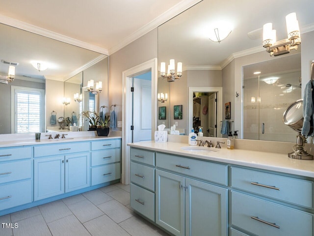 bathroom featuring vanity, a shower with shower door, and ornamental molding