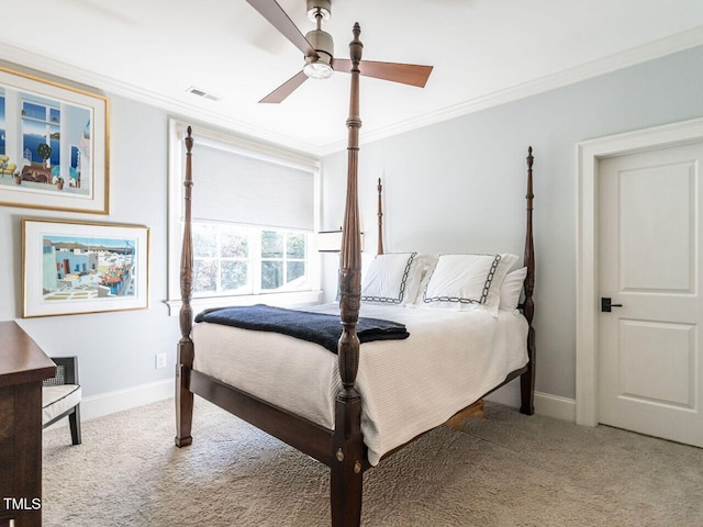 carpeted bedroom featuring crown molding and ceiling fan