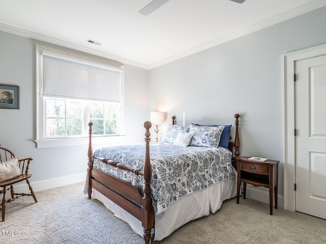 carpeted bedroom featuring ornamental molding and ceiling fan