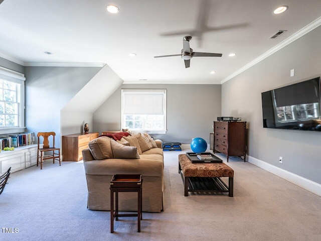 living room featuring crown molding, ceiling fan, and carpet