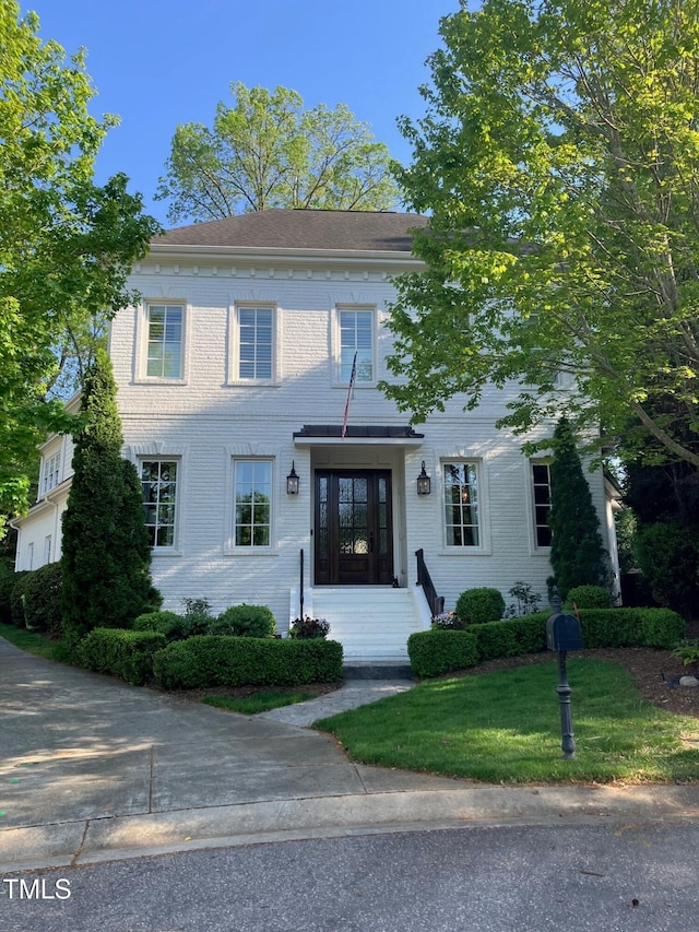 colonial house with a front yard