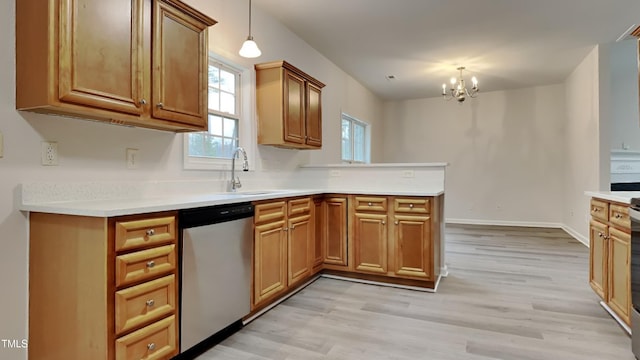 kitchen with dishwasher, decorative light fixtures, a notable chandelier, light wood-type flooring, and sink