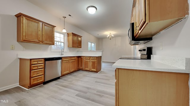 kitchen featuring kitchen peninsula, dishwasher, pendant lighting, light hardwood / wood-style floors, and stove