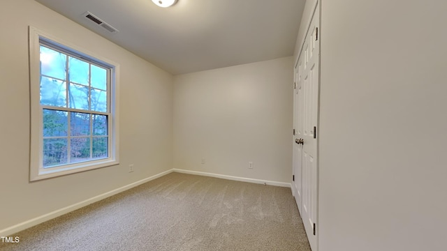 view of carpeted spare room