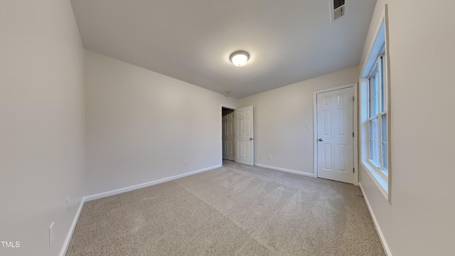 unfurnished bedroom featuring light colored carpet