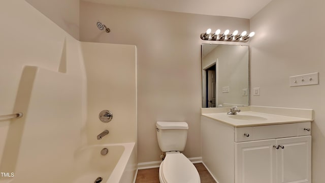 full bathroom with toilet, vanity, and  shower combination