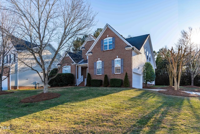 front of property with a front lawn and a garage