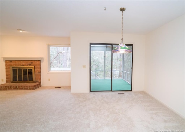 interior space with a fireplace and carpet flooring