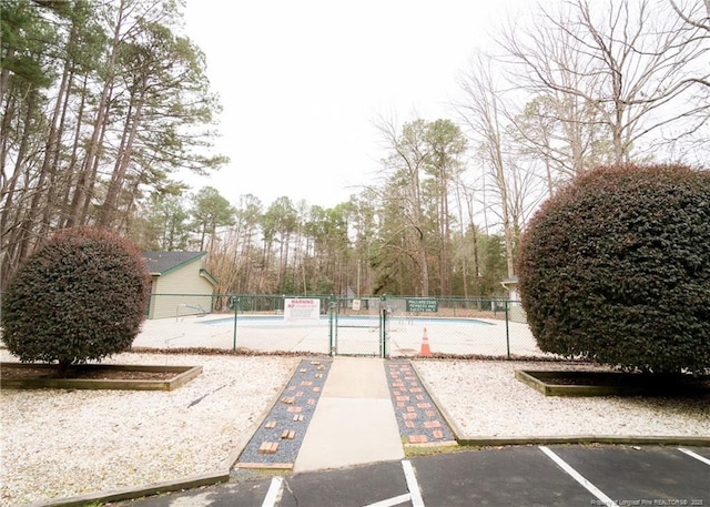 view of yard featuring a community pool