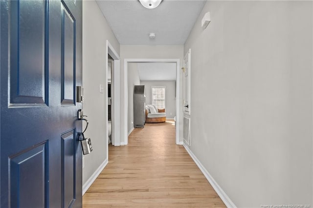 hallway featuring light hardwood / wood-style flooring