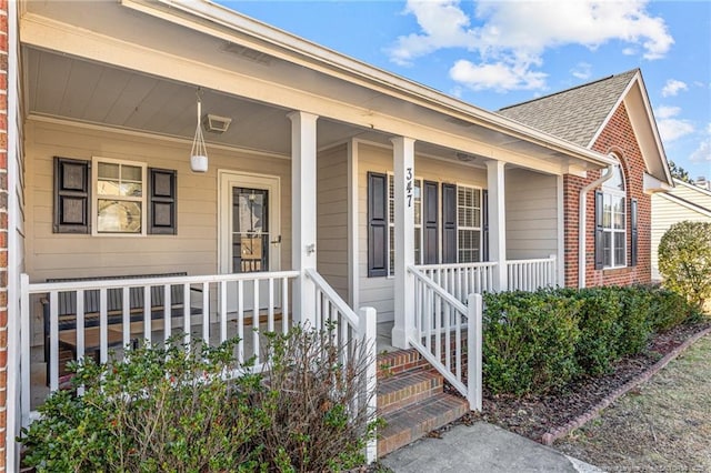 entrance to property featuring covered porch