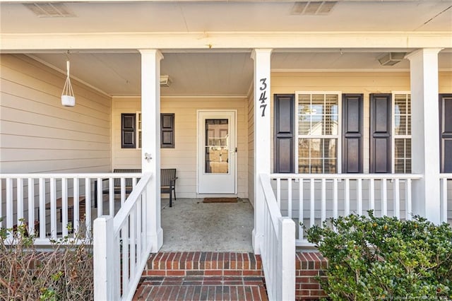 entrance to property with a porch