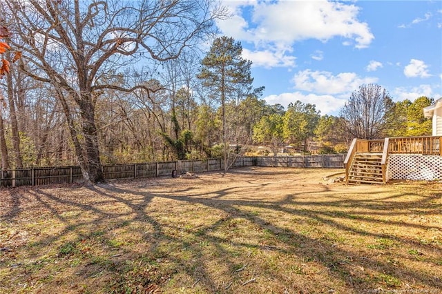 view of yard featuring a wooden deck