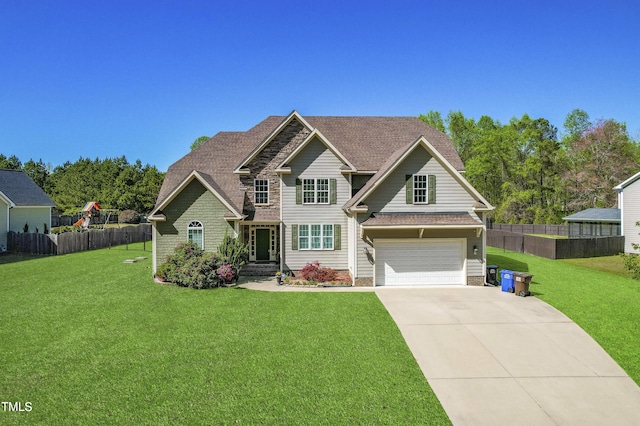 craftsman-style house with a garage and a front lawn