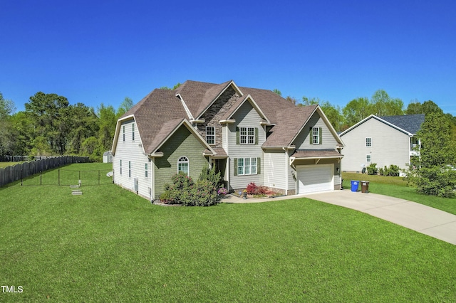 7945 Parker Mill Trl, Fuquay Varina, NC 27526 - view of front of house with a front lawn, stone siding, concrete driveway, fence, and an attached garage