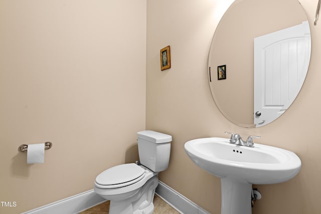 bathroom featuring tile patterned floors and toilet