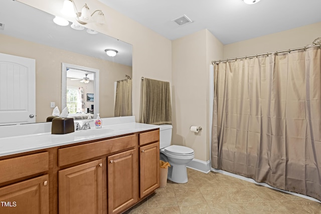 bathroom with vanity, tile patterned floors, and toilet