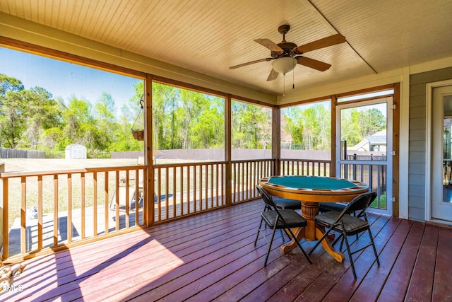 sunroom / solarium with ceiling fan