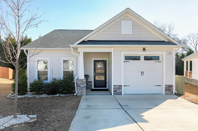 craftsman inspired home featuring a garage and a porch