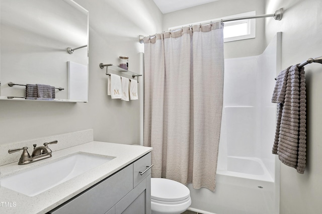 full bathroom with toilet, shower / bath combo, and vanity