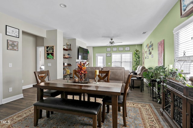 dining room featuring ceiling fan and dark hardwood / wood-style floors