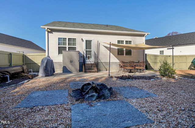 rear view of property featuring a patio area