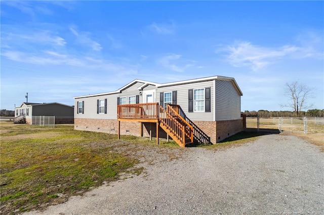 manufactured / mobile home with a wooden deck