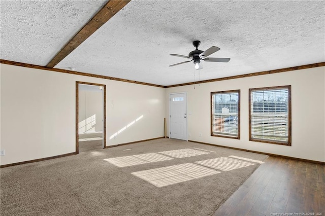 unfurnished room with hardwood / wood-style floors, a textured ceiling, ceiling fan, and beam ceiling