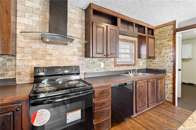 kitchen featuring a textured ceiling, dark hardwood / wood-style floors, wall chimney range hood, black appliances, and sink