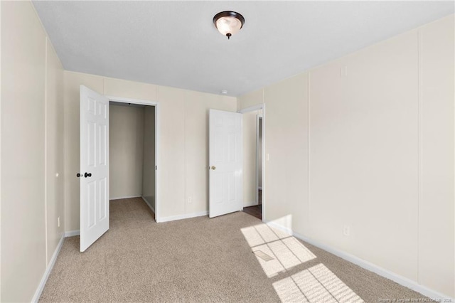 unfurnished bedroom with light carpet