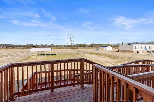 wooden deck with a rural view