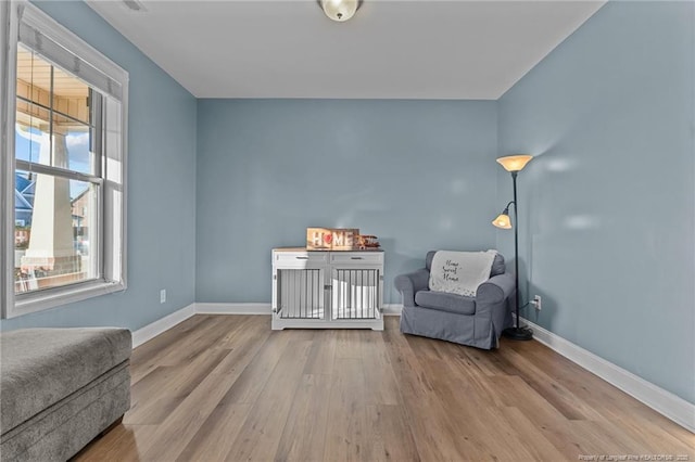 sitting room with light hardwood / wood-style floors