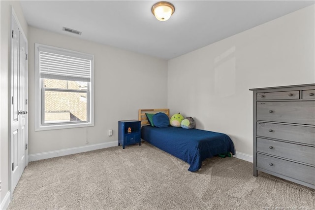 bedroom featuring light carpet