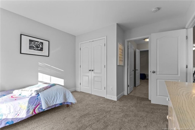 carpeted bedroom with a closet