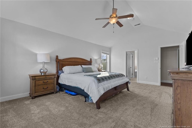 carpeted bedroom with ceiling fan, ensuite bathroom, and vaulted ceiling