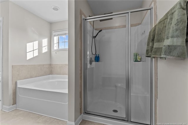 bathroom with plus walk in shower and tile patterned flooring