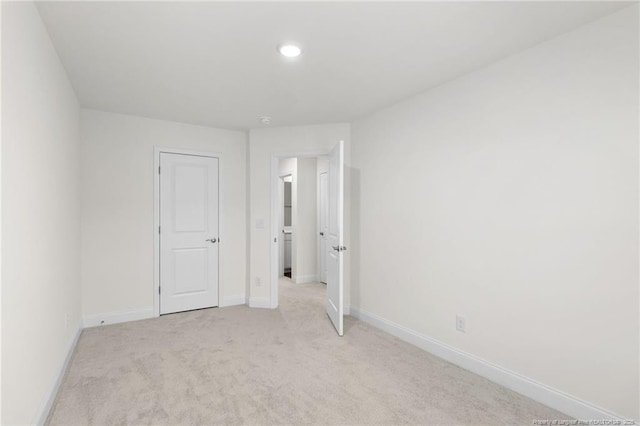 unfurnished bedroom with light carpet