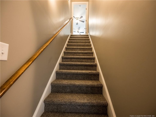 stairway with ceiling fan