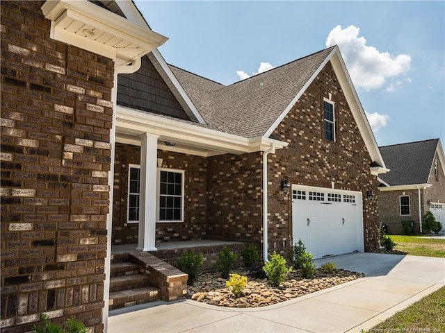 view of front of home with a garage and covered porch