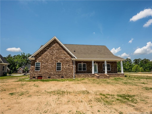 rear view of house with a porch