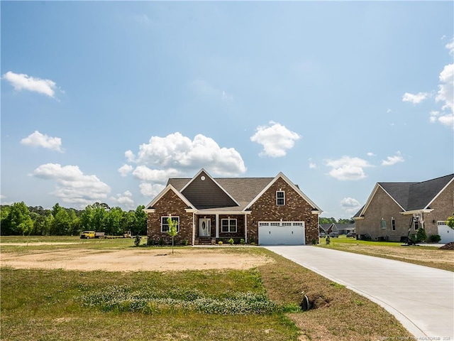 view of front of house with a front yard and a garage