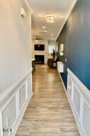 hallway featuring ornamental molding