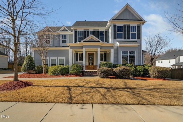 craftsman house with a front lawn