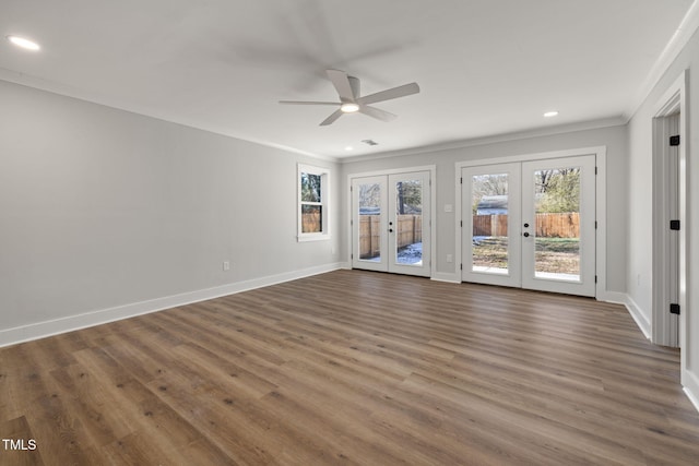 unfurnished room with ornamental molding, ceiling fan, french doors, and dark hardwood / wood-style floors