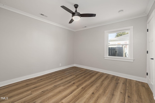 unfurnished room with ceiling fan, ornamental molding, and hardwood / wood-style flooring